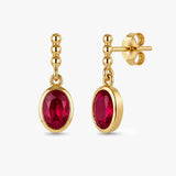Oval Drop Earrings with Beaded Accent in Gold